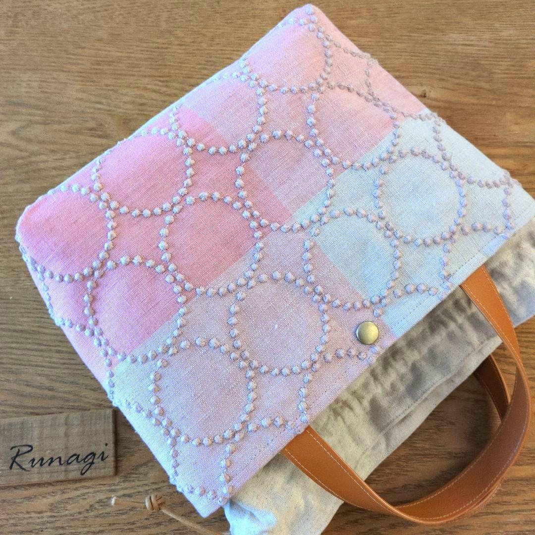 あおりポケットの巾着バッグ＊ミナペルホネン